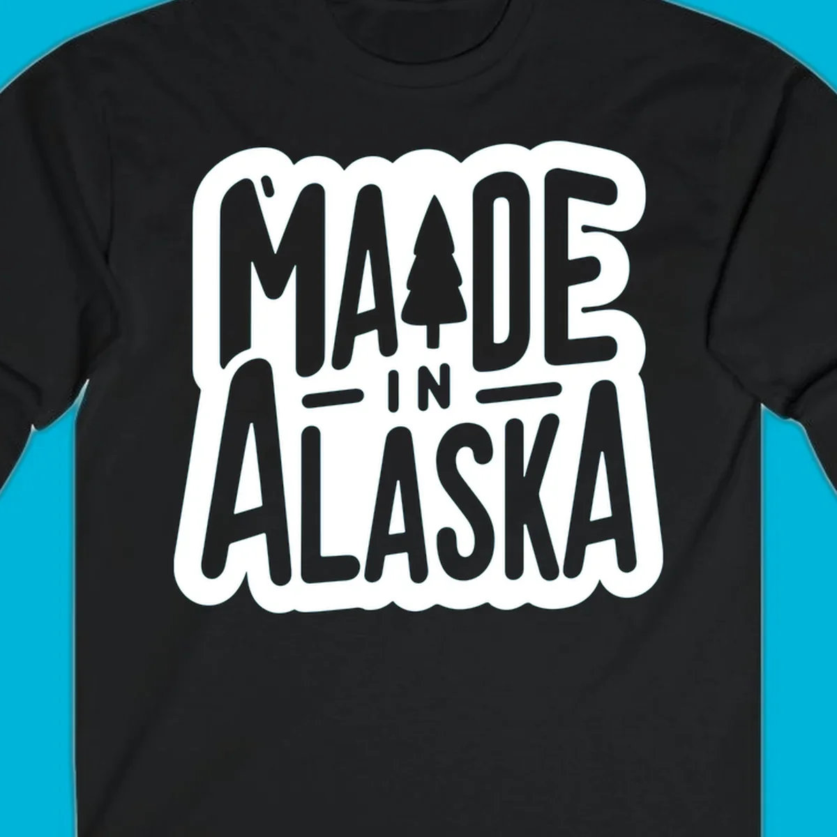 Stylized 'MADE IN ALASKA' text with a pine tree silhouette. A made-in-alaska-tree design.