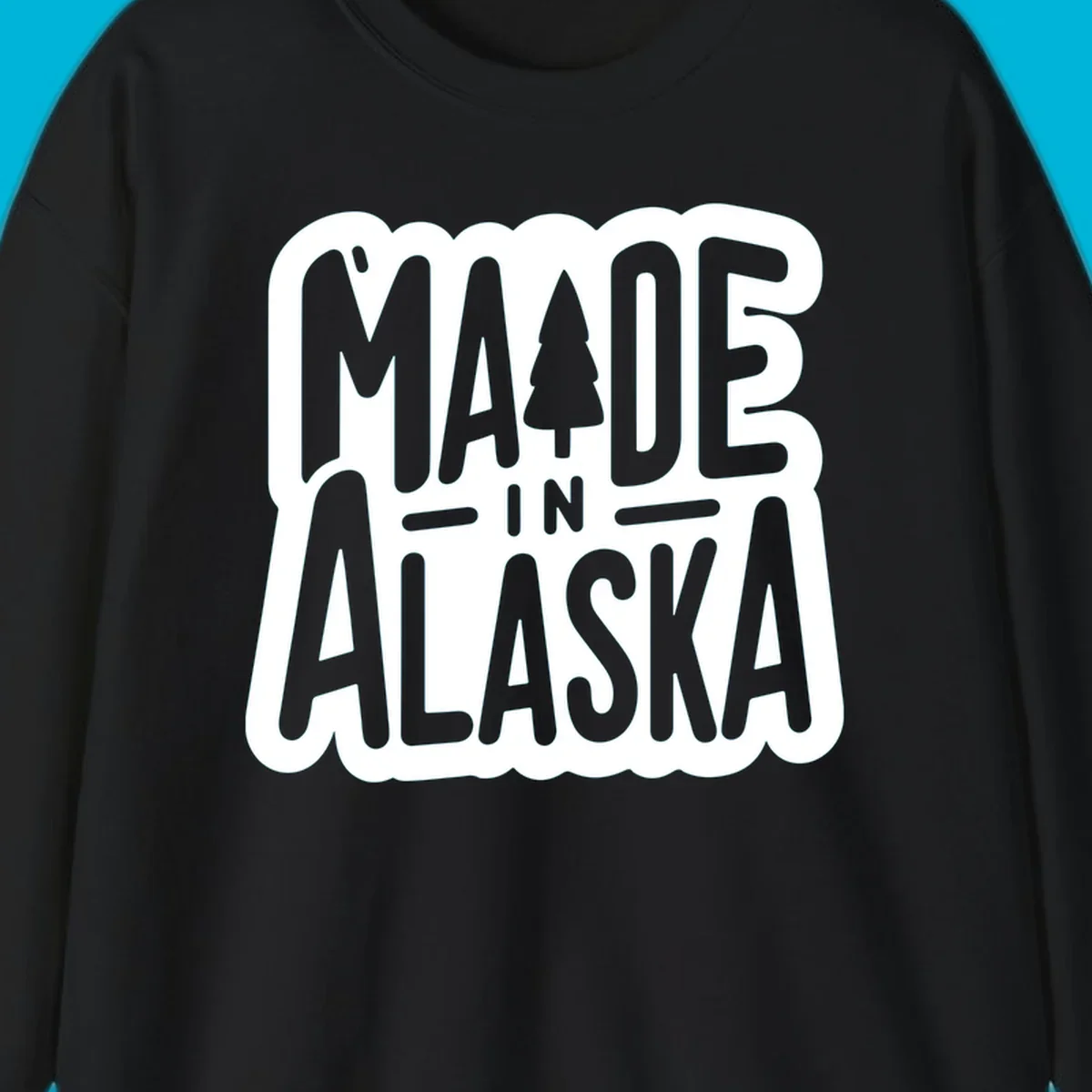 Stylized 'MADE IN ALASKA' text with a pine tree silhouette. A made-in-alaska-tree design.