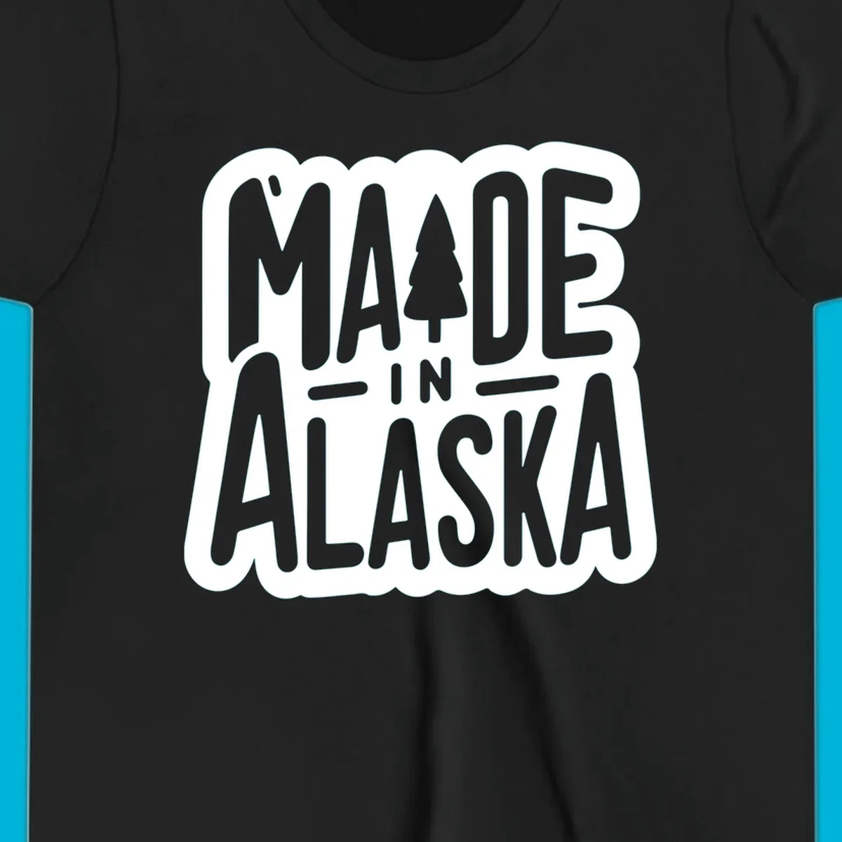 Stylized 'MADE IN ALASKA' text with a pine tree silhouette. A made-in-alaska-tree design.