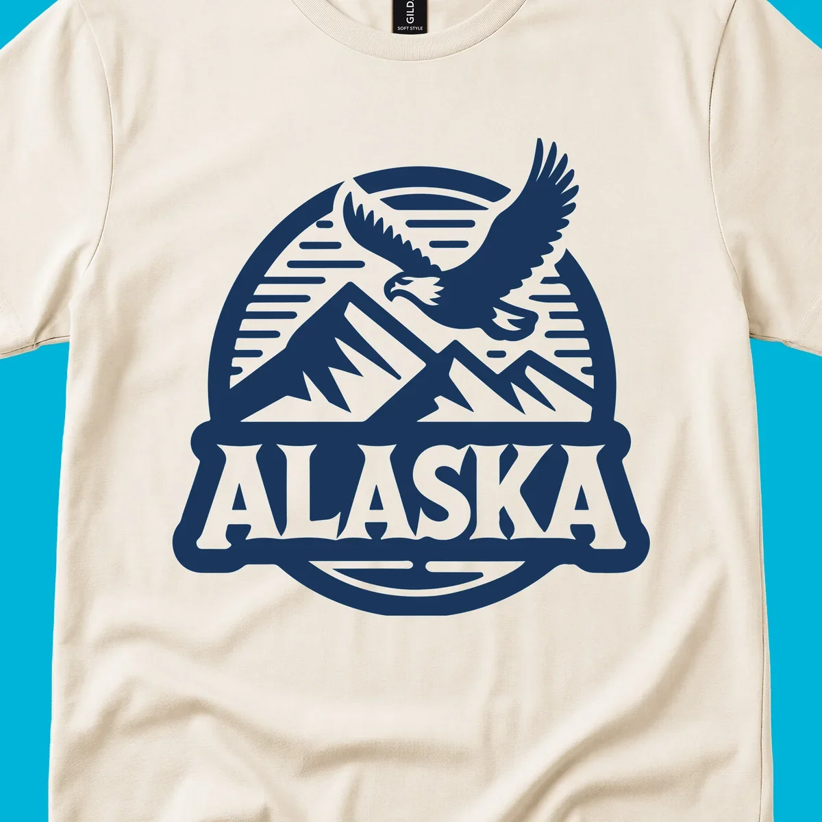 Vintage Alaska badge design with a flying eagle over mountains and 'ALASKA' text in a banner.