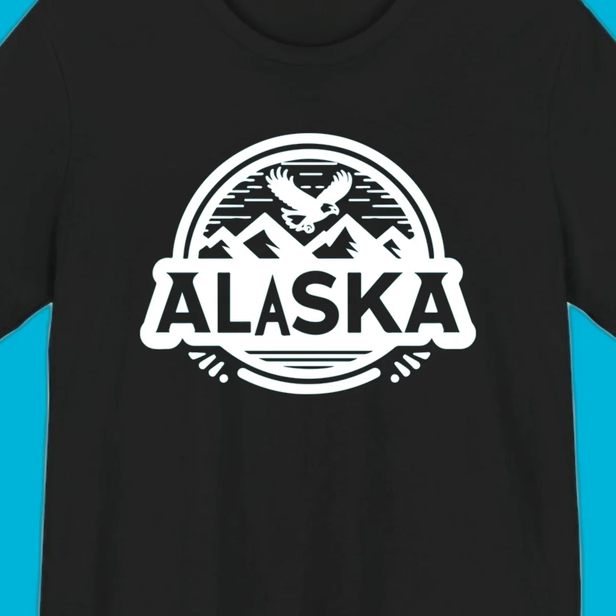 An oval badge design with a bald eagle flying above mountains and water, and the word ALASKA in bold text; alaska-eagle-mountain-badge.