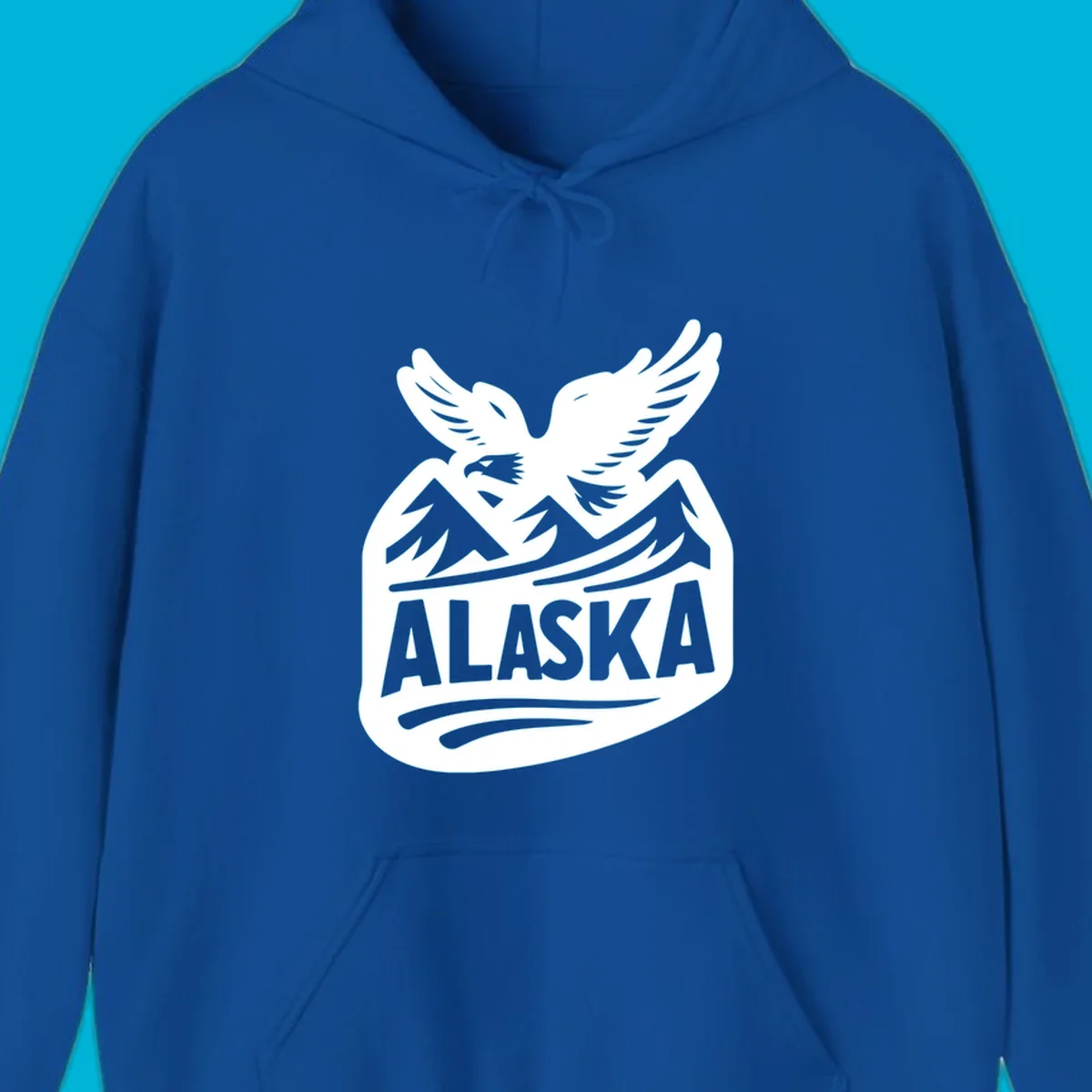 A white and dark blue badge design showing a flying eagle over mountain peaks with "ALASKA" text, for a cruise souvenir.