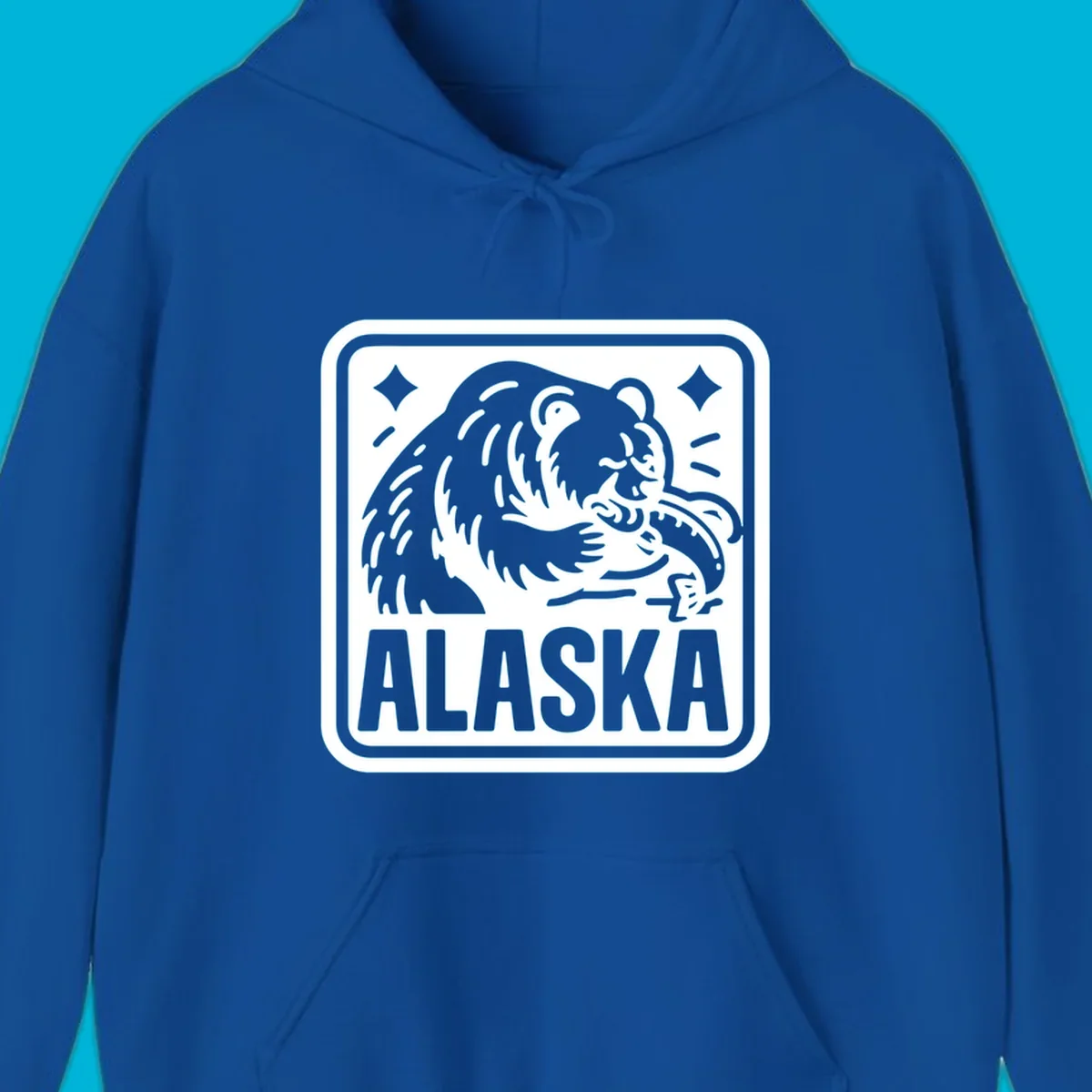A white alaskan grizzly salmon fishing illustration within a rectangular badge, with 'ALASKA' text.