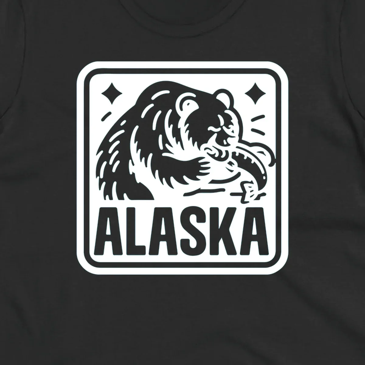 A white alaskan grizzly salmon fishing illustration within a rectangular badge, with 'ALASKA' text.