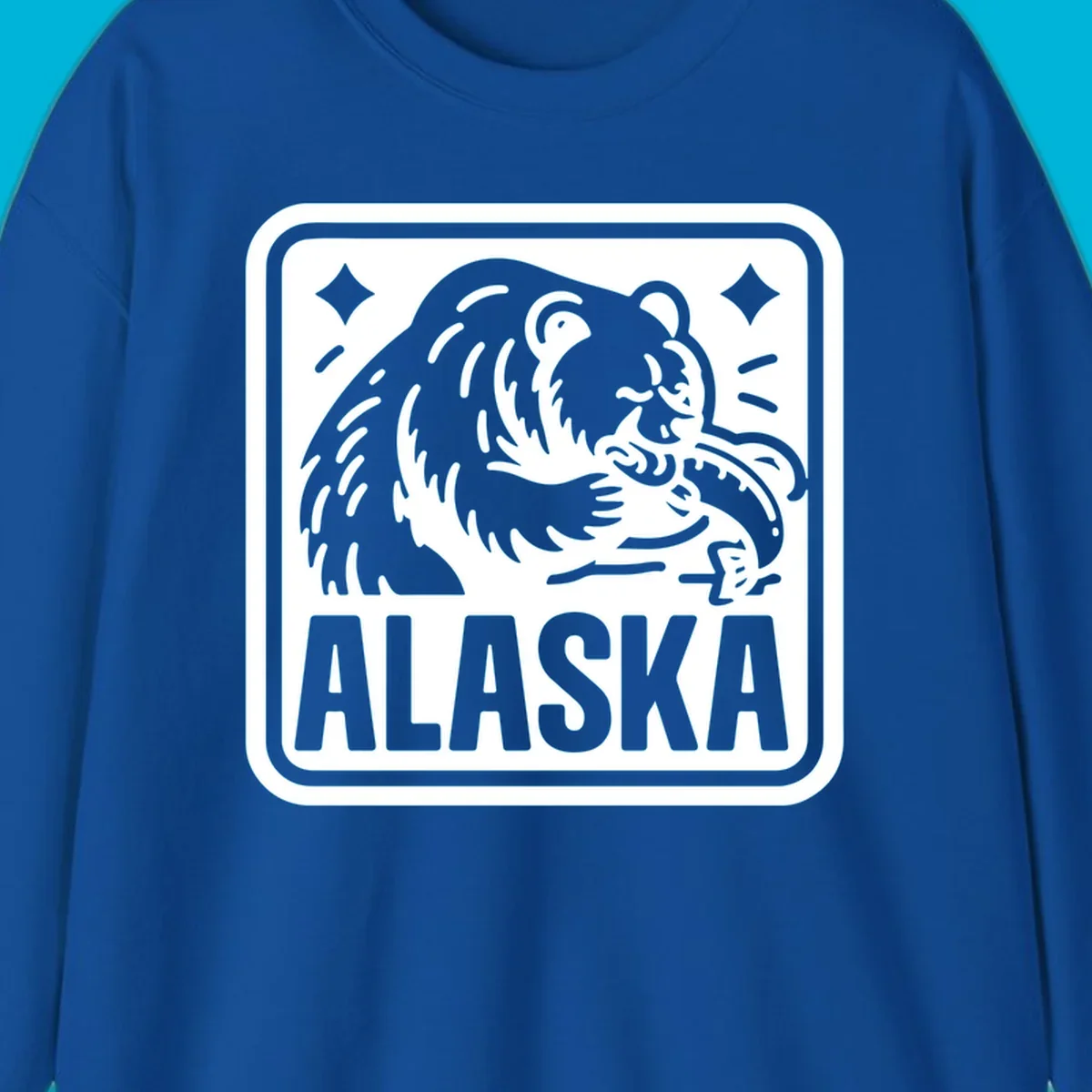 A white alaskan grizzly salmon fishing illustration within a rectangular badge, with 'ALASKA' text.