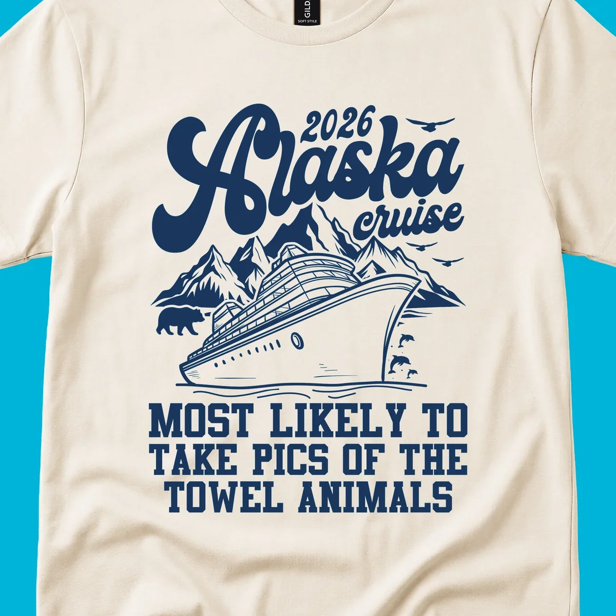 Illustrated design for 2026 Alaska cruise with a ship, mountains, bear, dolphins, and text about taking pics of towel animals.
