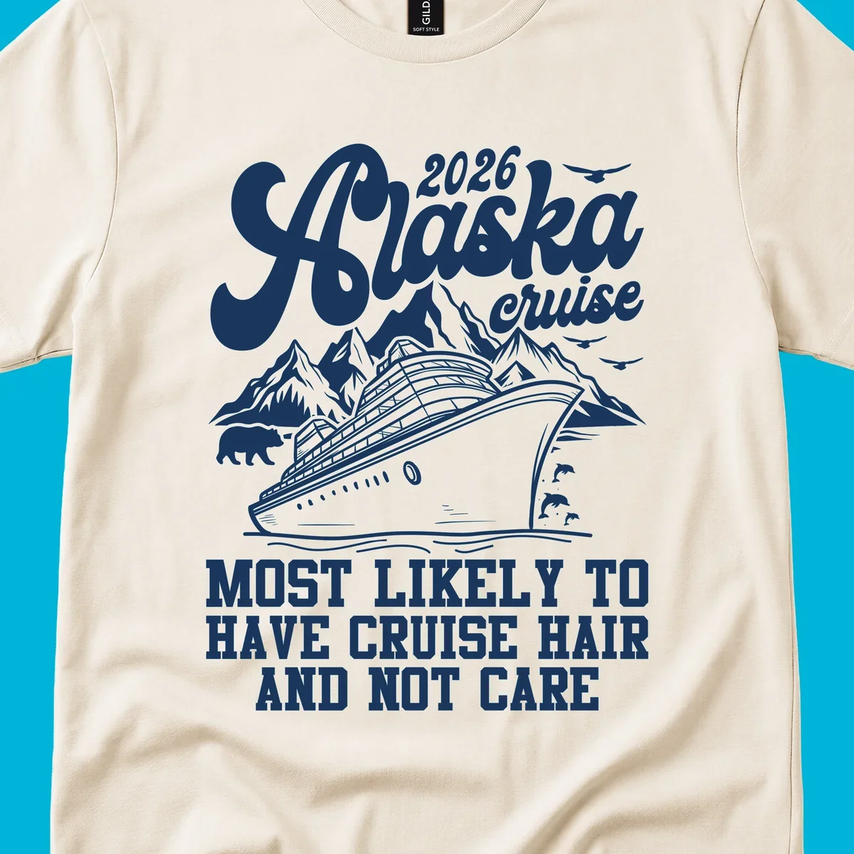 A 2026 Alaska cruise design with a ship, mountains, bear, and 'Most Likely To Have Cruise Hair And Not Care' text. Features a cruise-hair-not-care concept.