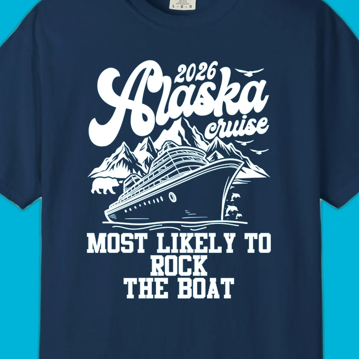 An illustrated Alaska cruise rock the boat design with a ship, mountains, bear, dolphins, and birds.