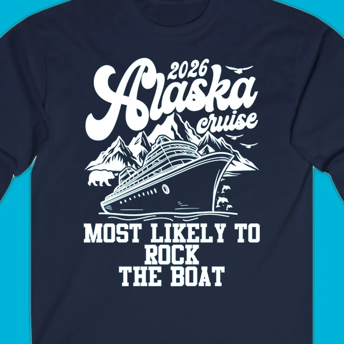 An illustrated Alaska cruise rock the boat design with a ship, mountains, bear, dolphins, and birds.