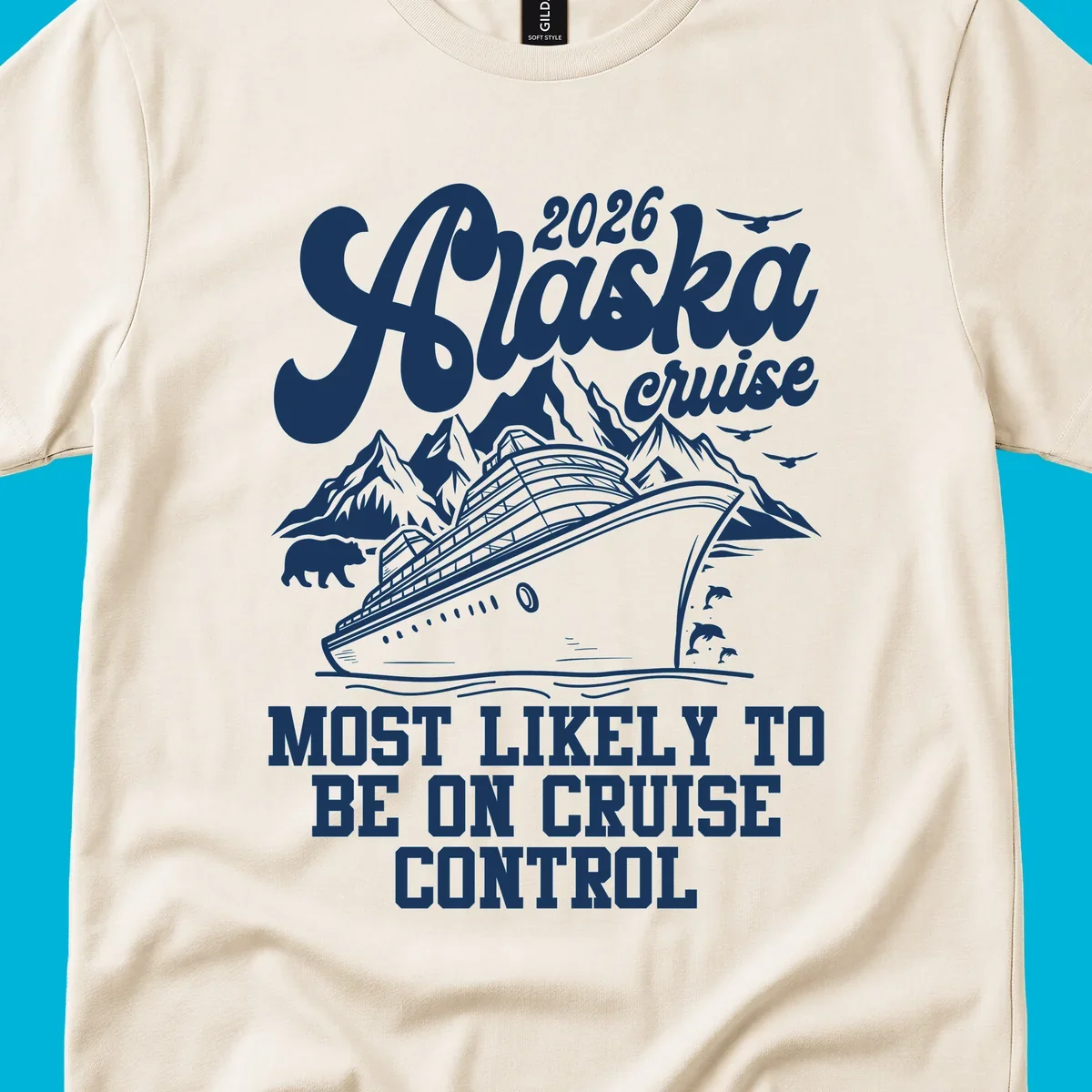Illustration of a cruise ship sailing past mountains with a bear, dolphins, and seagulls. Text reads '2026 Alaska cruise MOST LIKELY TO BE ON CRUISE CONTROL'.