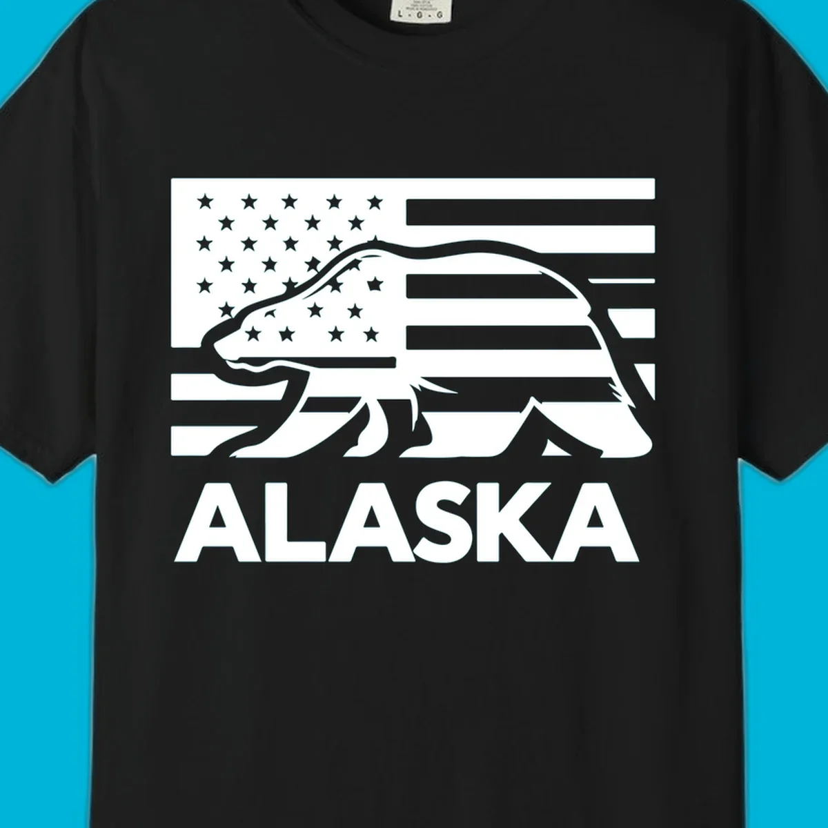 A walking bear silhouette filled with an American flag, with "ALASKA" text below. Features an alaska-bear-flag-silhouette.