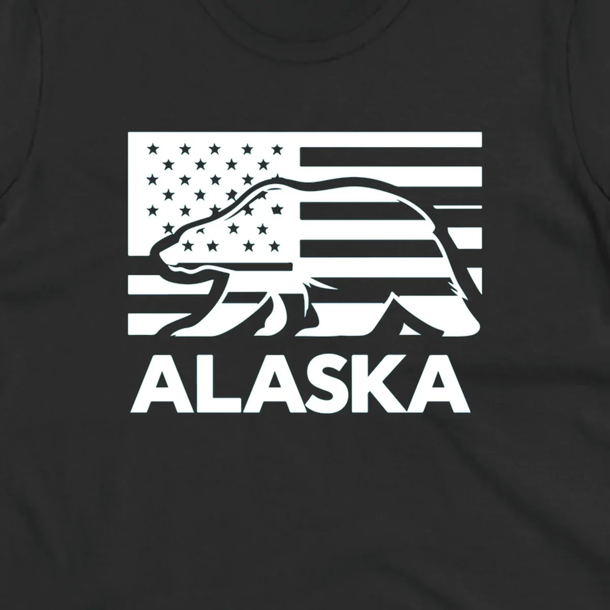 A walking bear silhouette filled with an American flag, with "ALASKA" text below. Features an alaska-bear-flag-silhouette.