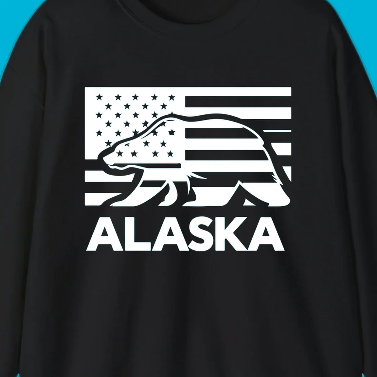 A walking bear silhouette filled with an American flag, with "ALASKA" text below. Features an alaska-bear-flag-silhouette.