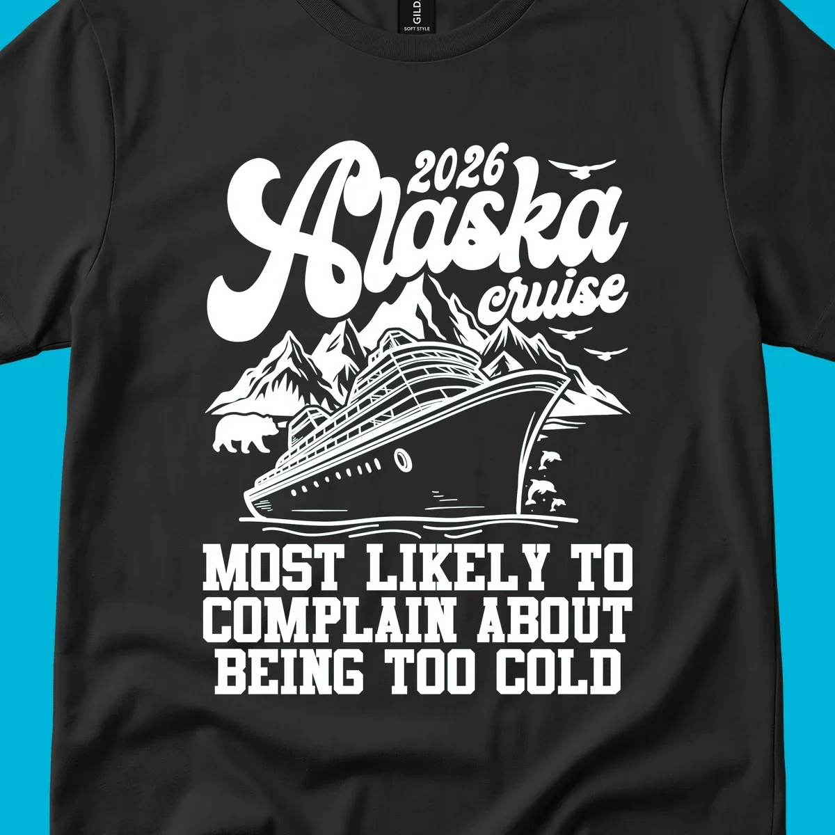 A white design on a black background of a cruise ship, mountains, bear, dolphins, and text "2026 Alaska cruise MOST LIKELY TO COMPLAIN ABOUT BEING TOO COLD".