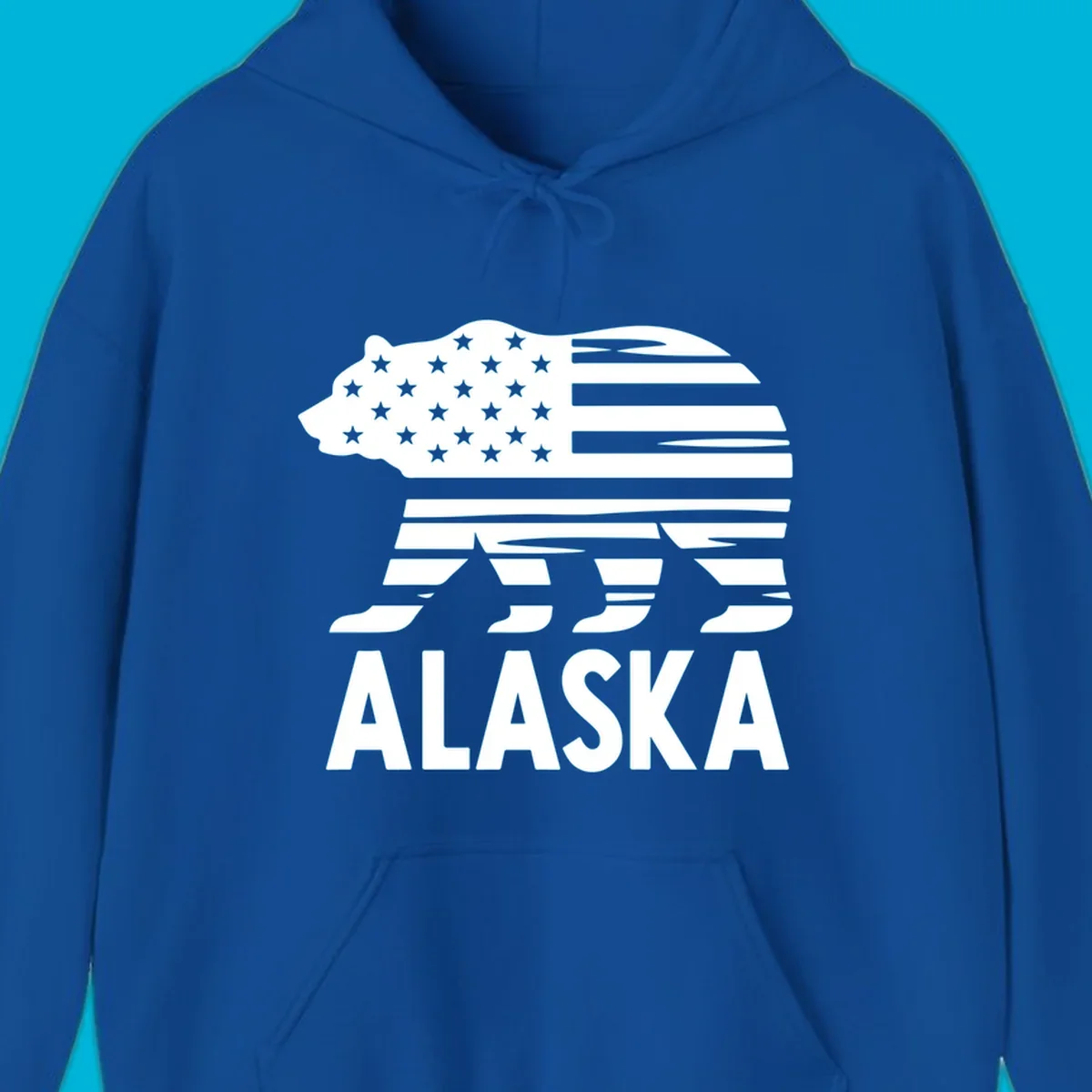 A white bear silhouette filled with the American flag and the text ALASKA. Represents an alaska-flag-bear.