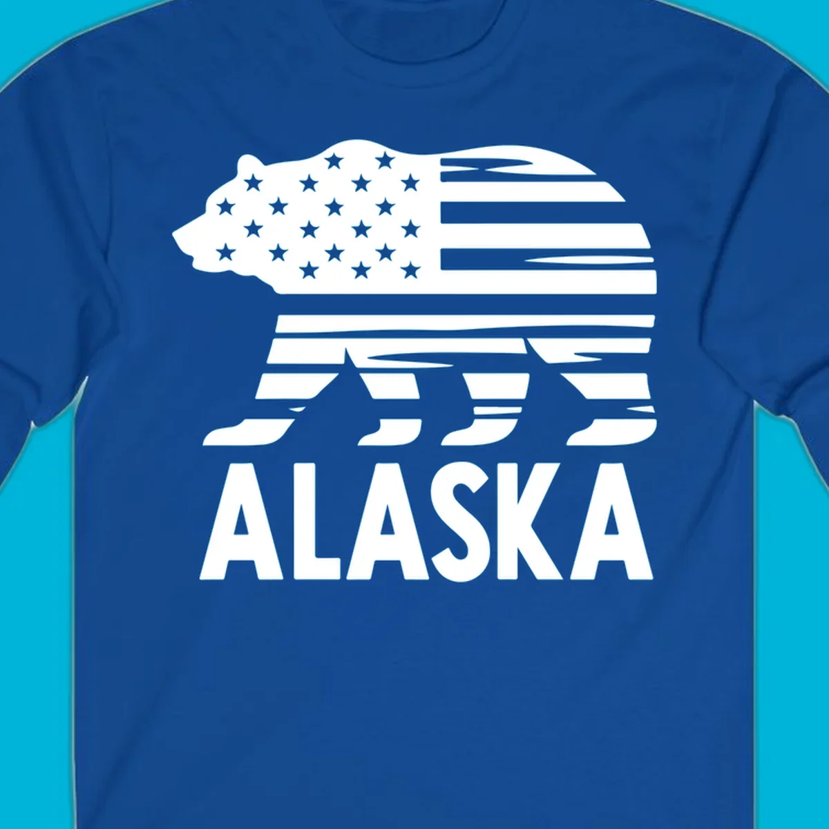 A white bear silhouette filled with the American flag and the text ALASKA. Represents an alaska-flag-bear.