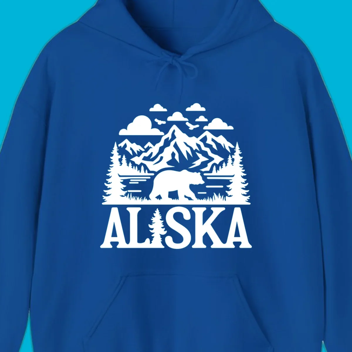 Graphic of an alaska-bear-mountain-view with a bear, mountains, forest, a lake, clouds, and birds, with 'ALASKA' text.