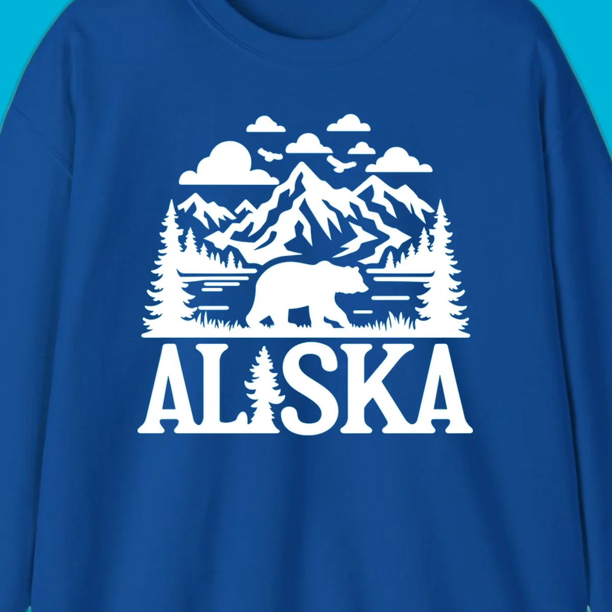 Graphic of an alaska-bear-mountain-view with a bear, mountains, forest, a lake, clouds, and birds, with 'ALASKA' text.