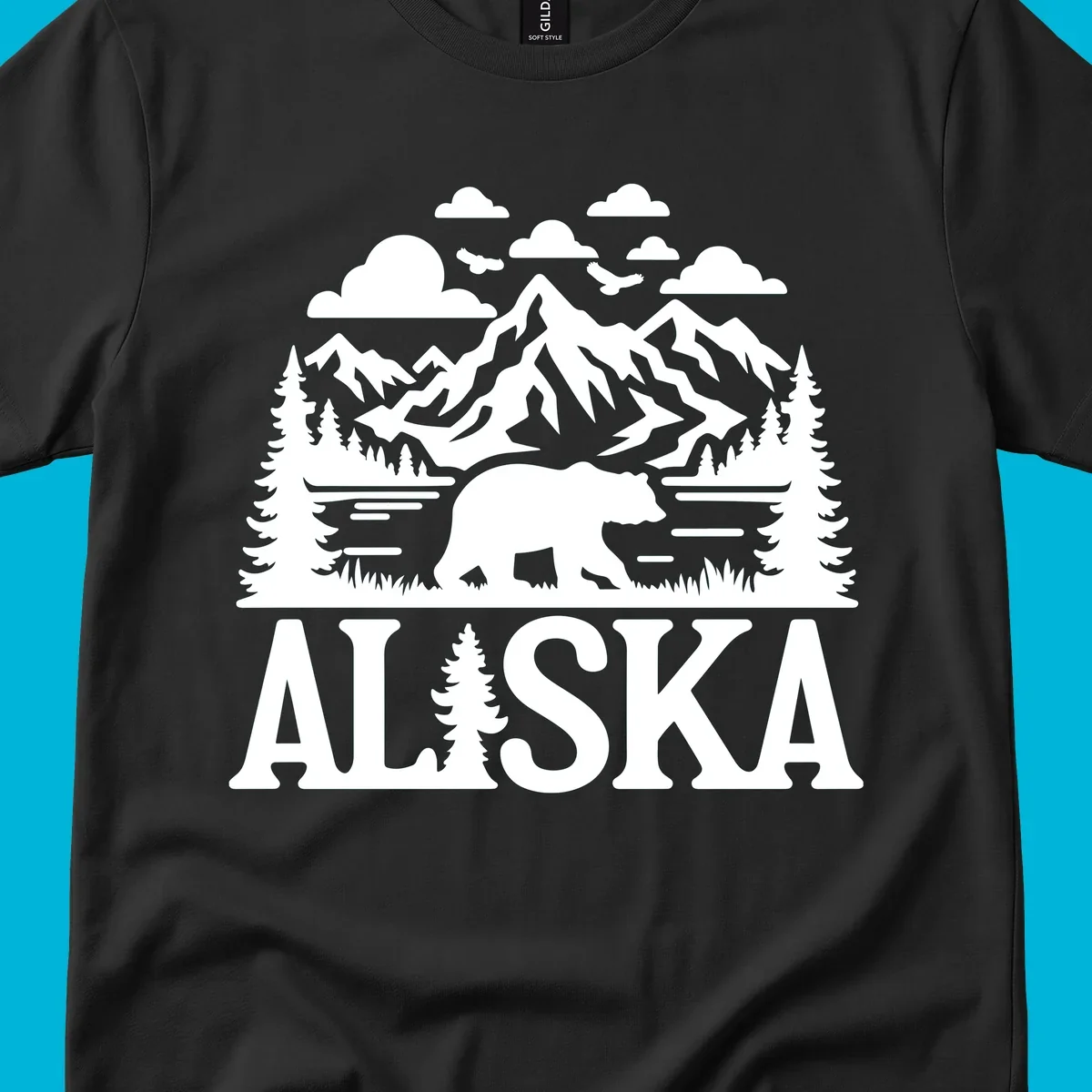 Graphic of an alaska-bear-mountain-view with a bear, mountains, forest, a lake, clouds, and birds, with 'ALASKA' text.