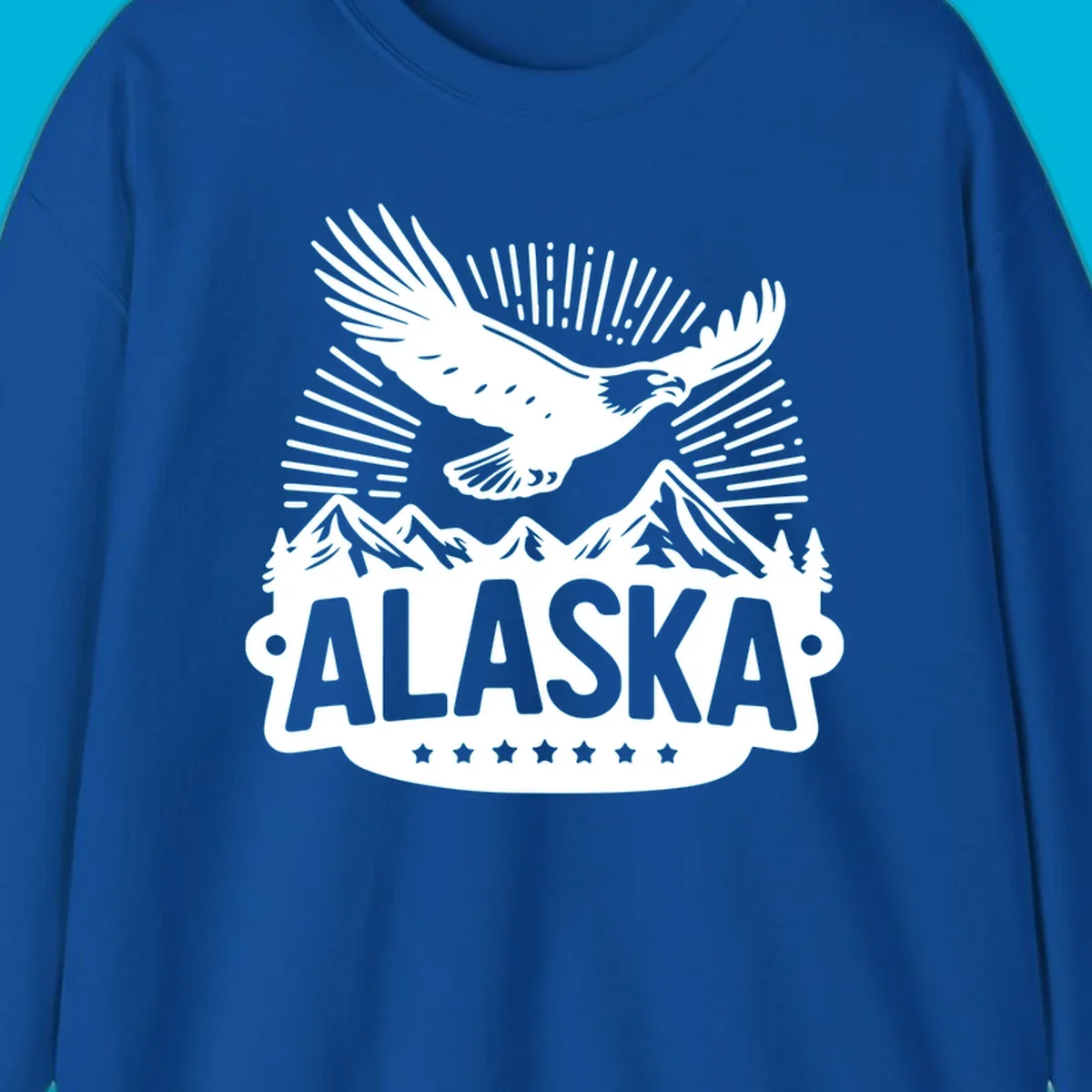Vintage style Alaska eagle mountain view design with a soaring bald eagle over mountains and pine trees, with ALASKA text.