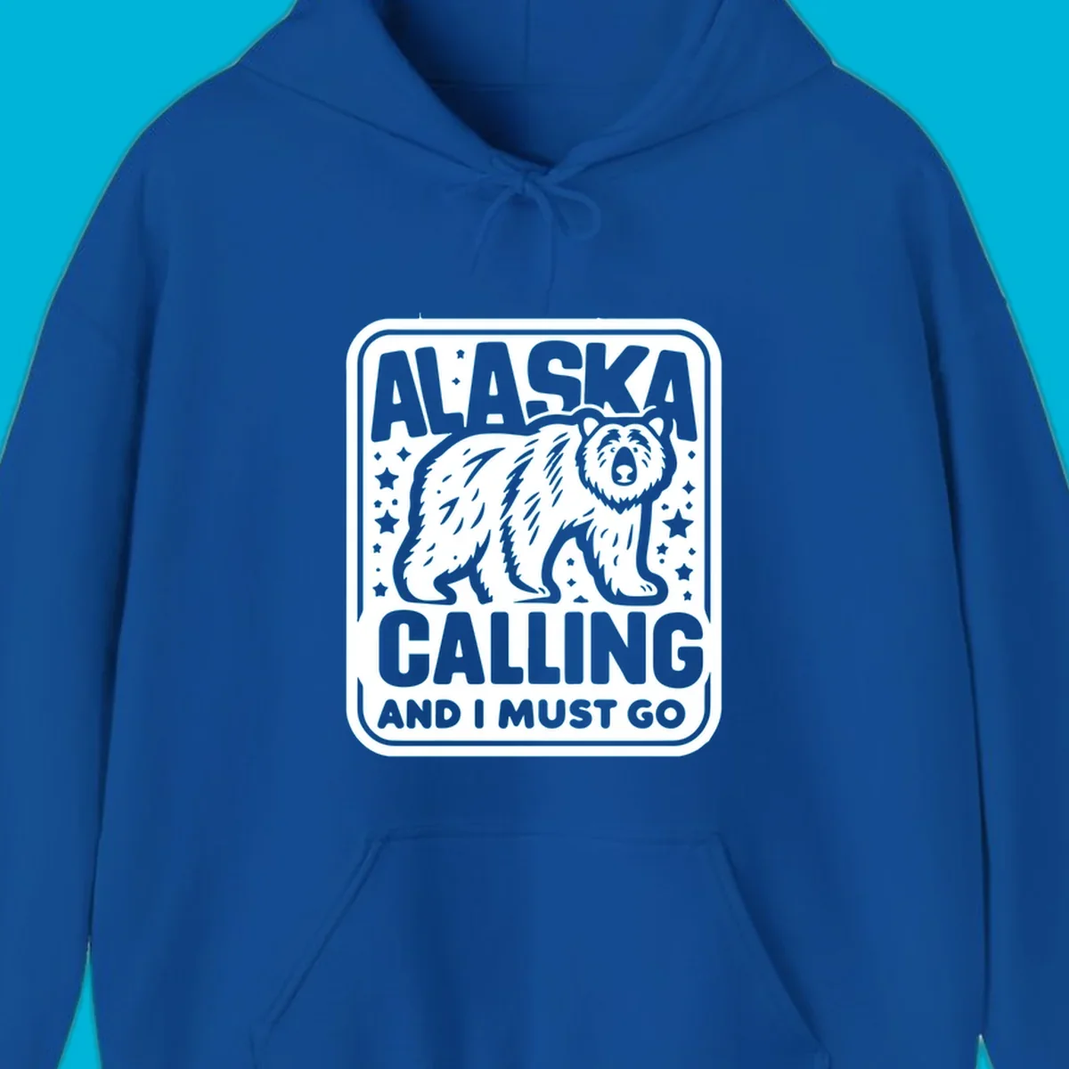 A vintage-style illustration of a bear with stars and the text 'ALASKA CALLING AND I MUST GO'.