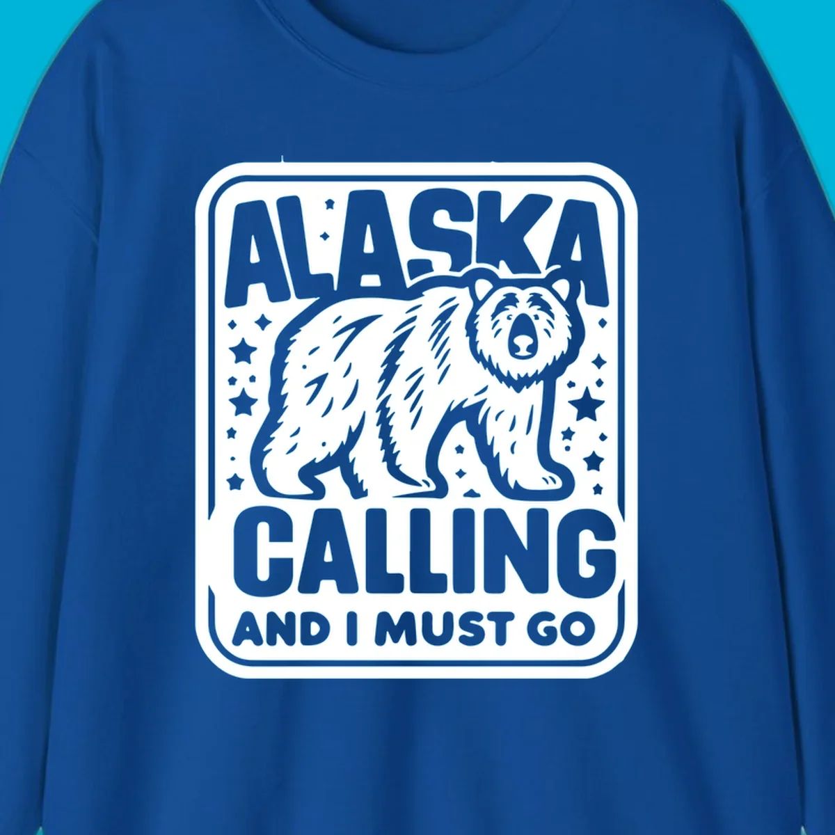 A vintage-style illustration of a bear with stars and the text 'ALASKA CALLING AND I MUST GO'.