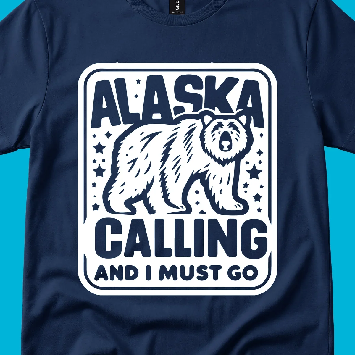 A vintage-style illustration of a bear with stars and the text 'ALASKA CALLING AND I MUST GO'.