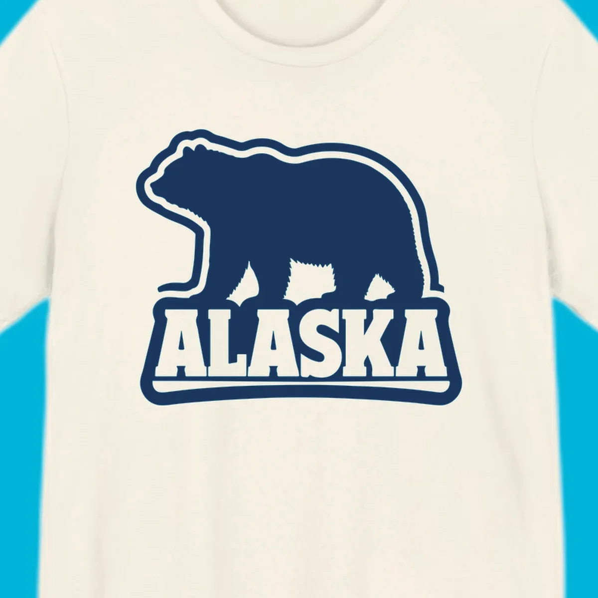 A vintage Alaska bear emblem featuring a navy bear silhouette above the word ALASKA, all with a white outline.