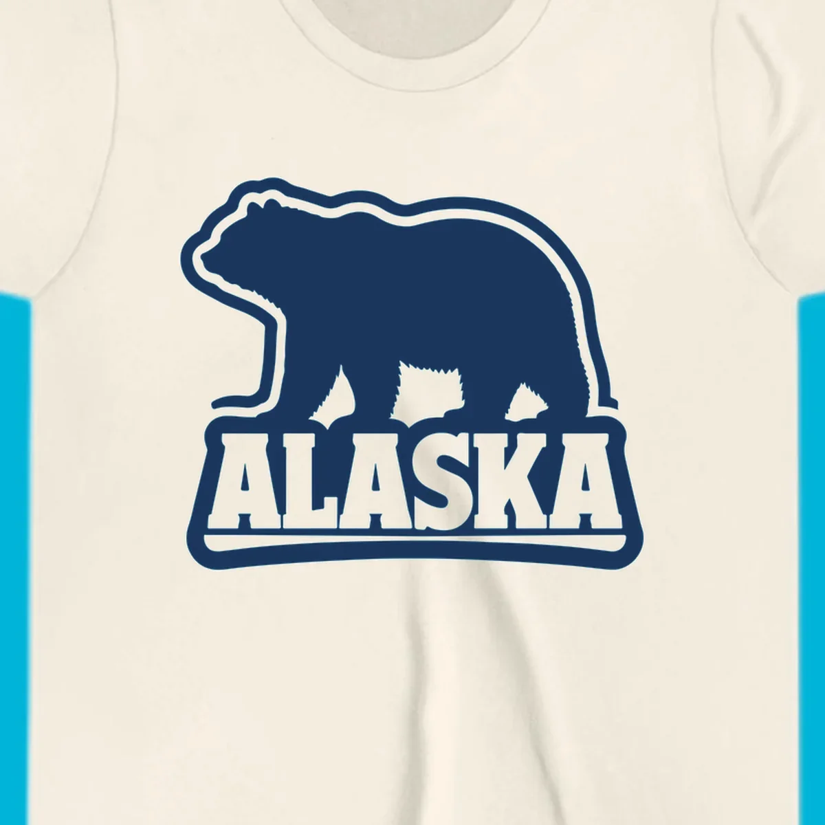 A vintage Alaska bear emblem featuring a navy bear silhouette above the word ALASKA, all with a white outline.