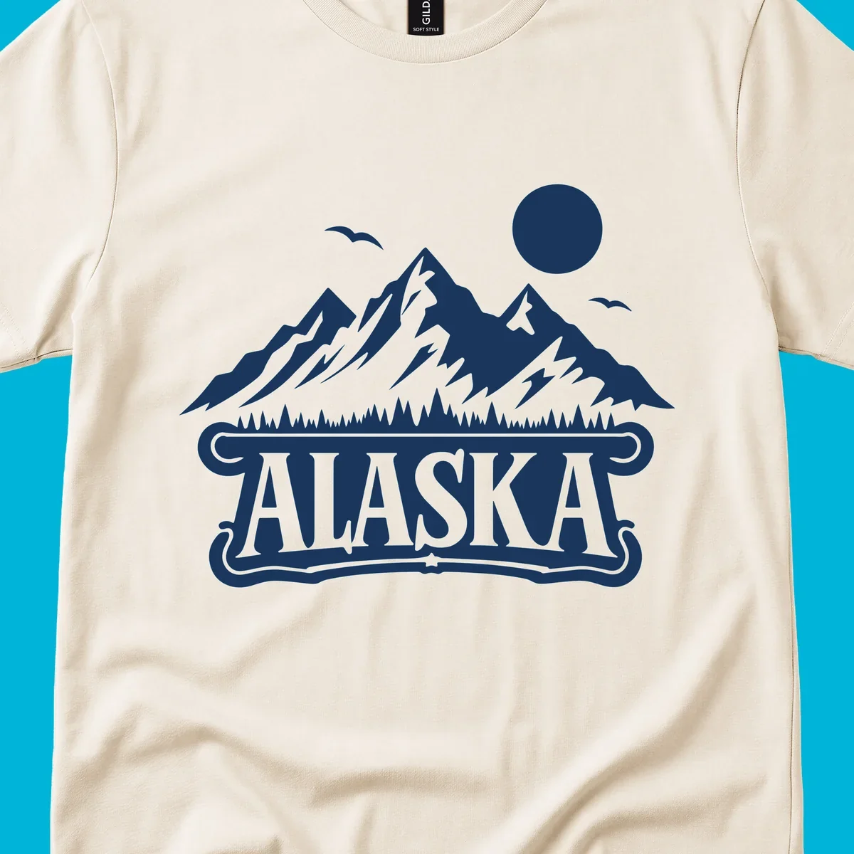 Monochrome illustration of Alaska mountains, forest, sun, and birds above a decorative 'ALASKA' banner, representing alaska-mountain-forest-scenic.