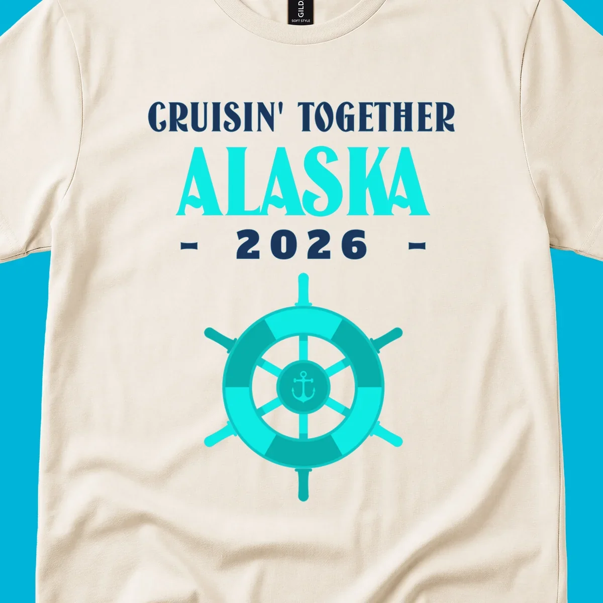 A cruise design with text 'CRUISIN' TOGETHER ALASKA 2026' and a teal ship wheel with an anchor, for a cruisin-together-alaska-2026.