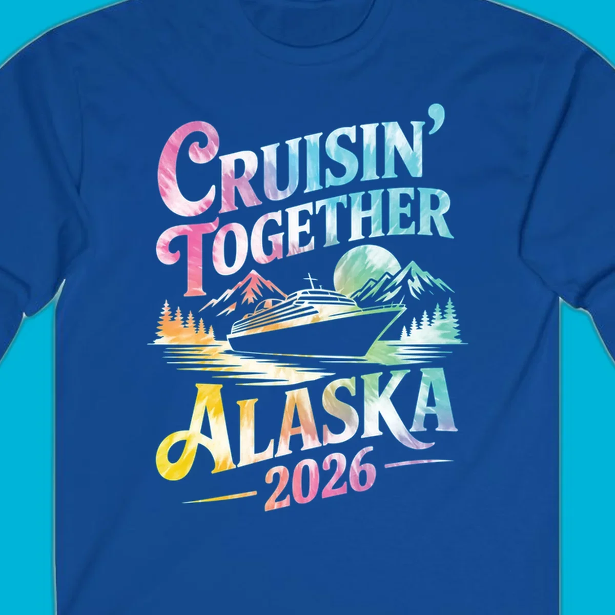 A tie-dye graphic featuring a cruise ship, mountains, and trees, with the text 'CRUISIN' TOGETHER ALASKA 2026'. This alaska-cruise-2026-tie-dye design shows a scenic view.