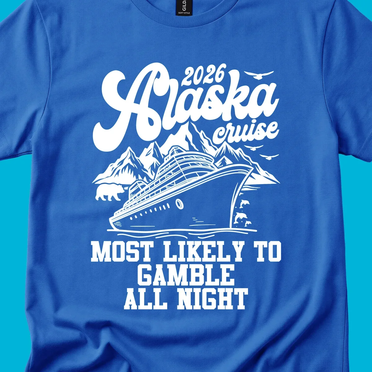 An illustrated Alaska cruise ship sails past mountains, a bear, birds, and dolphins. Text: 2026 Alaska Cruise Most Likely to Gamble All Night.