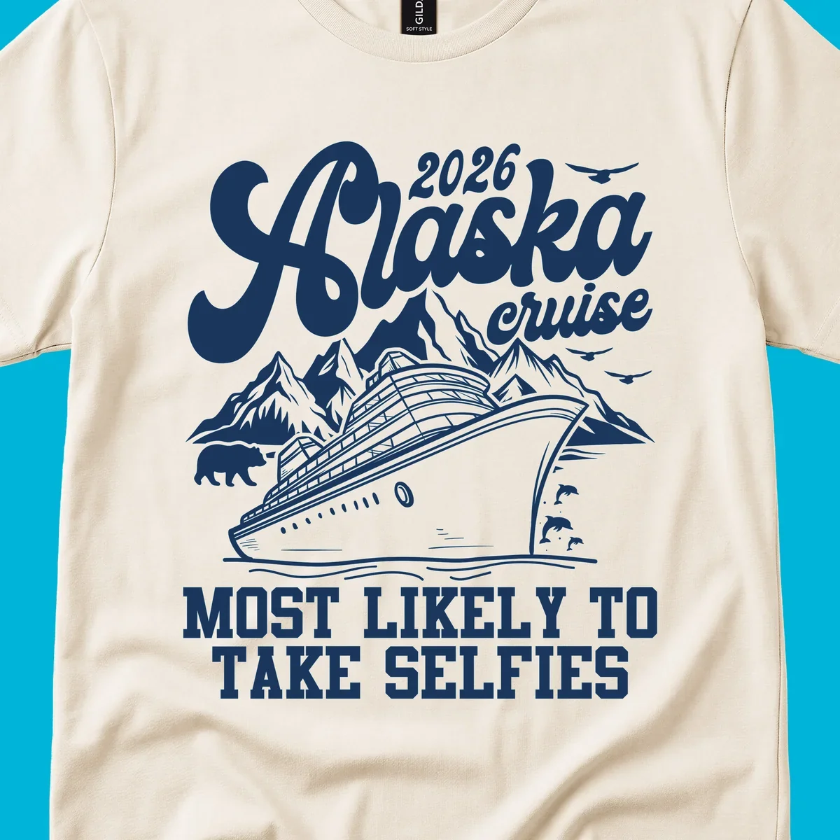 A white illustration of a cruise ship, mountains, bear, dolphins, and birds with '2026 Alaska cruise MOST LIKELY TO TAKE SELFIES' text for a most-likely-selfies-cruise.