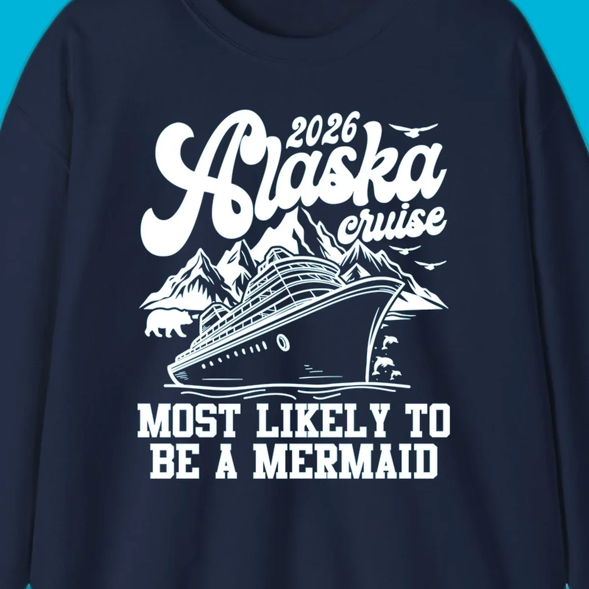 Vintage-style 2026 Alaska cruise design with a ship, mountains, bear, dolphins, and text "Most Likely To Be A Mermaid".