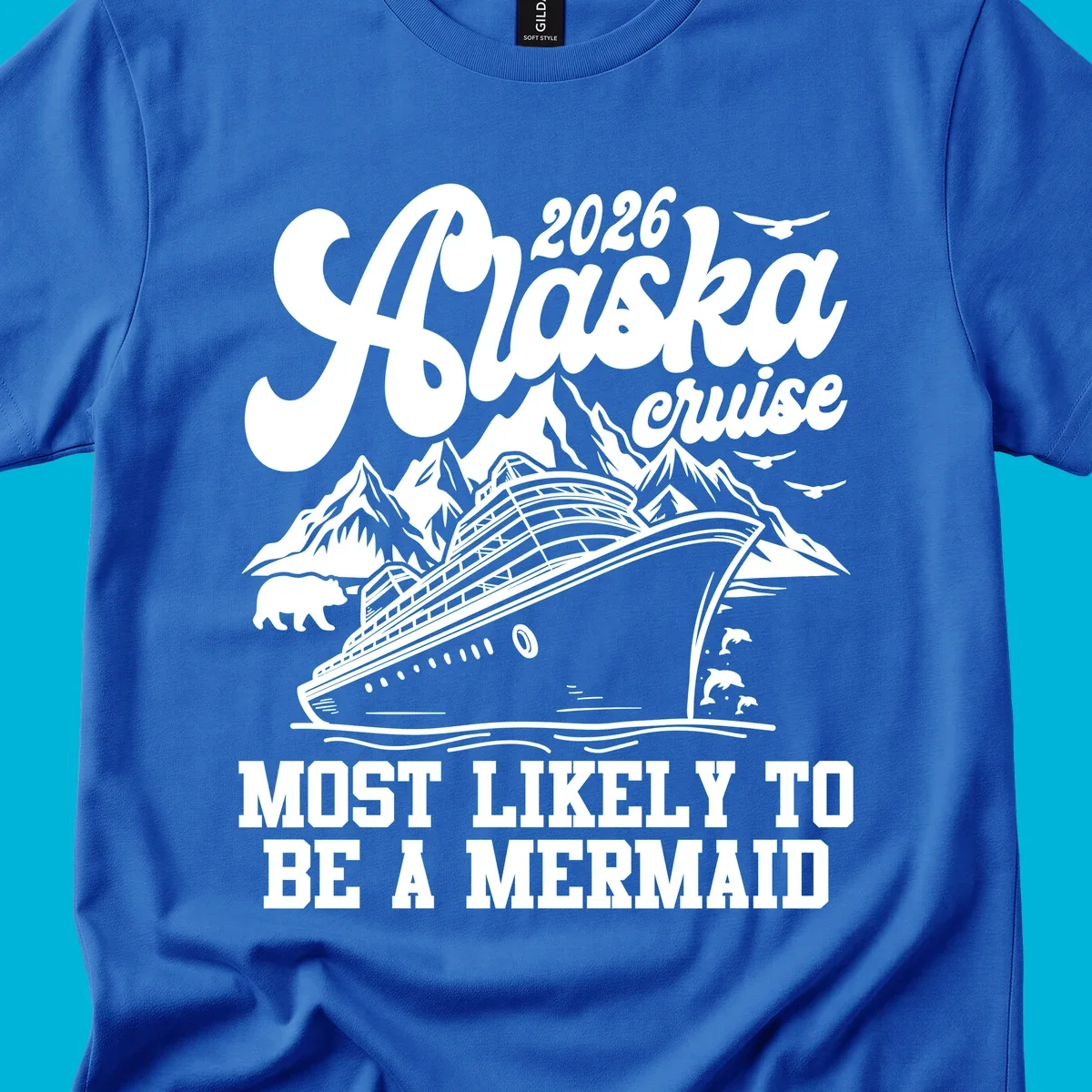 Vintage-style 2026 Alaska cruise design with a ship, mountains, bear, dolphins, and text "Most Likely To Be A Mermaid".
