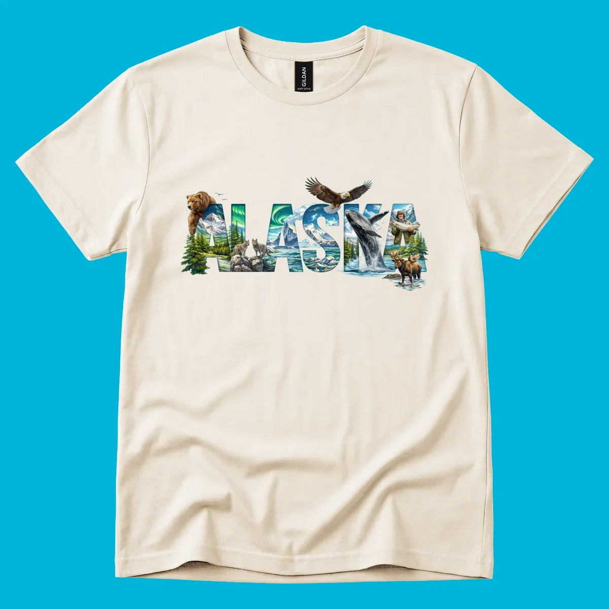 An illustrated text design spelling "ALASKA" with images of a grizzly, mountains, northern lights, wolves, ocean, bald eagle, whale, fisherman, and moose. This alaska-wildlife-scenic-text design captures the state's natural beauty.