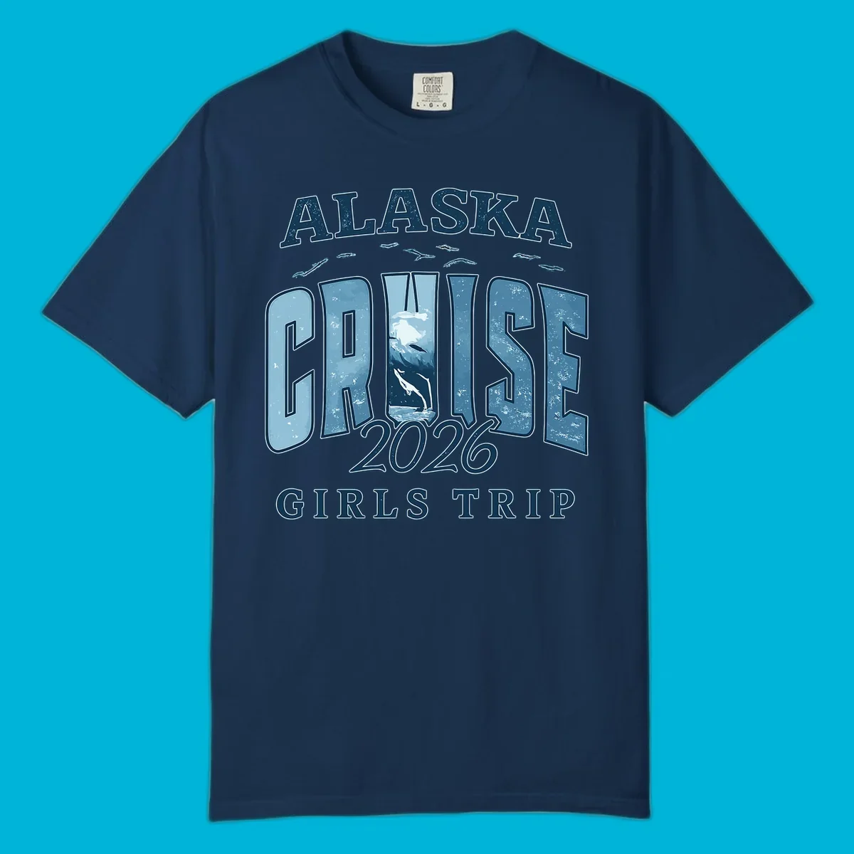 Alaska Cruise 2026 Girls Trip design with whales jumping and swimming within the letters of CRUISE, set against distressed blue text.
