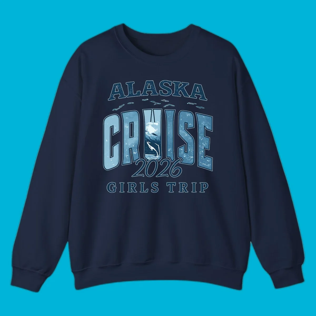Alaska Cruise 2026 Girls Trip design with whales jumping and swimming within the letters of CRUISE, set against distressed blue text.