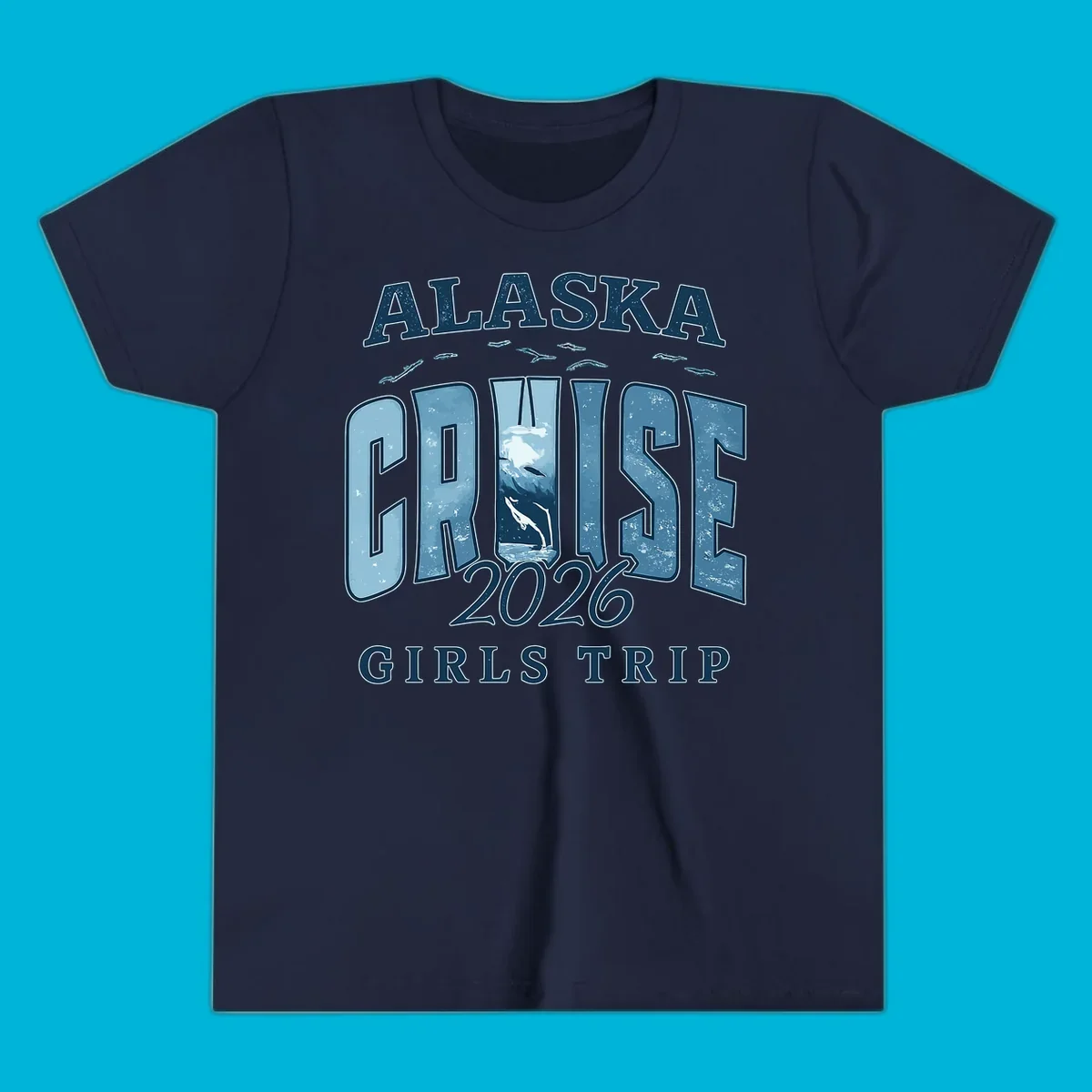 Alaska Cruise 2026 Girls Trip design with whales jumping and swimming within the letters of CRUISE, set against distressed blue text.