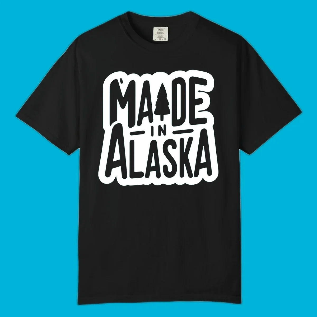 Stylized 'MADE IN ALASKA' text with a pine tree silhouette. A made-in-alaska-tree design.