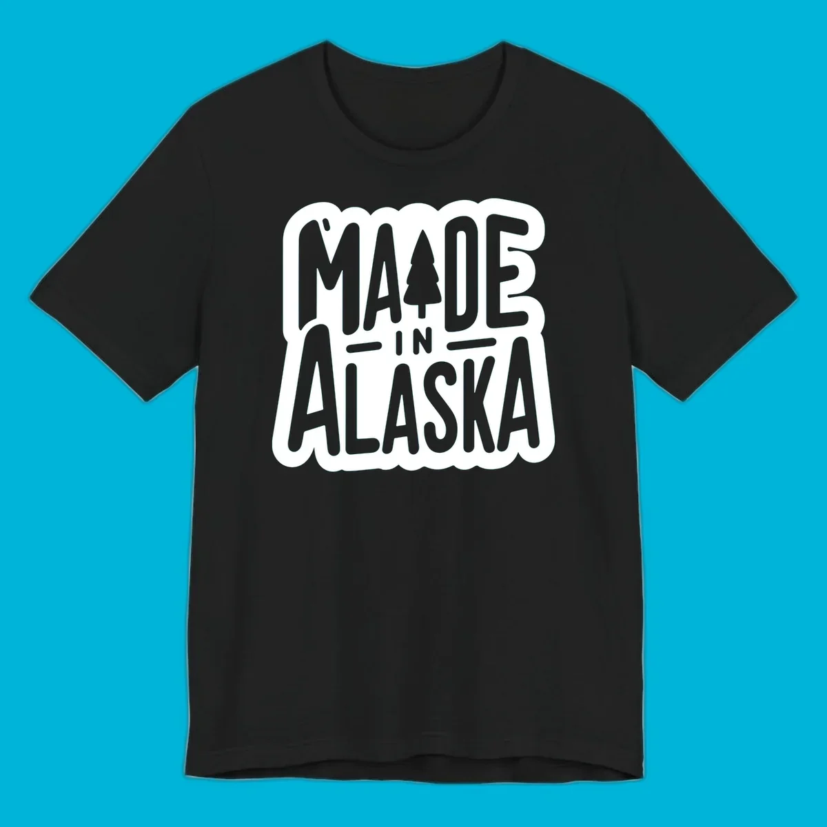 Stylized 'MADE IN ALASKA' text with a pine tree silhouette. A made-in-alaska-tree design.