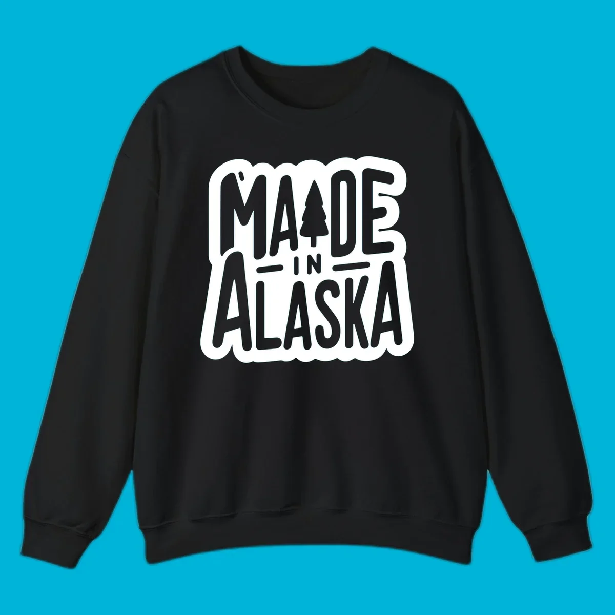 Stylized 'MADE IN ALASKA' text with a pine tree silhouette. A made-in-alaska-tree design.