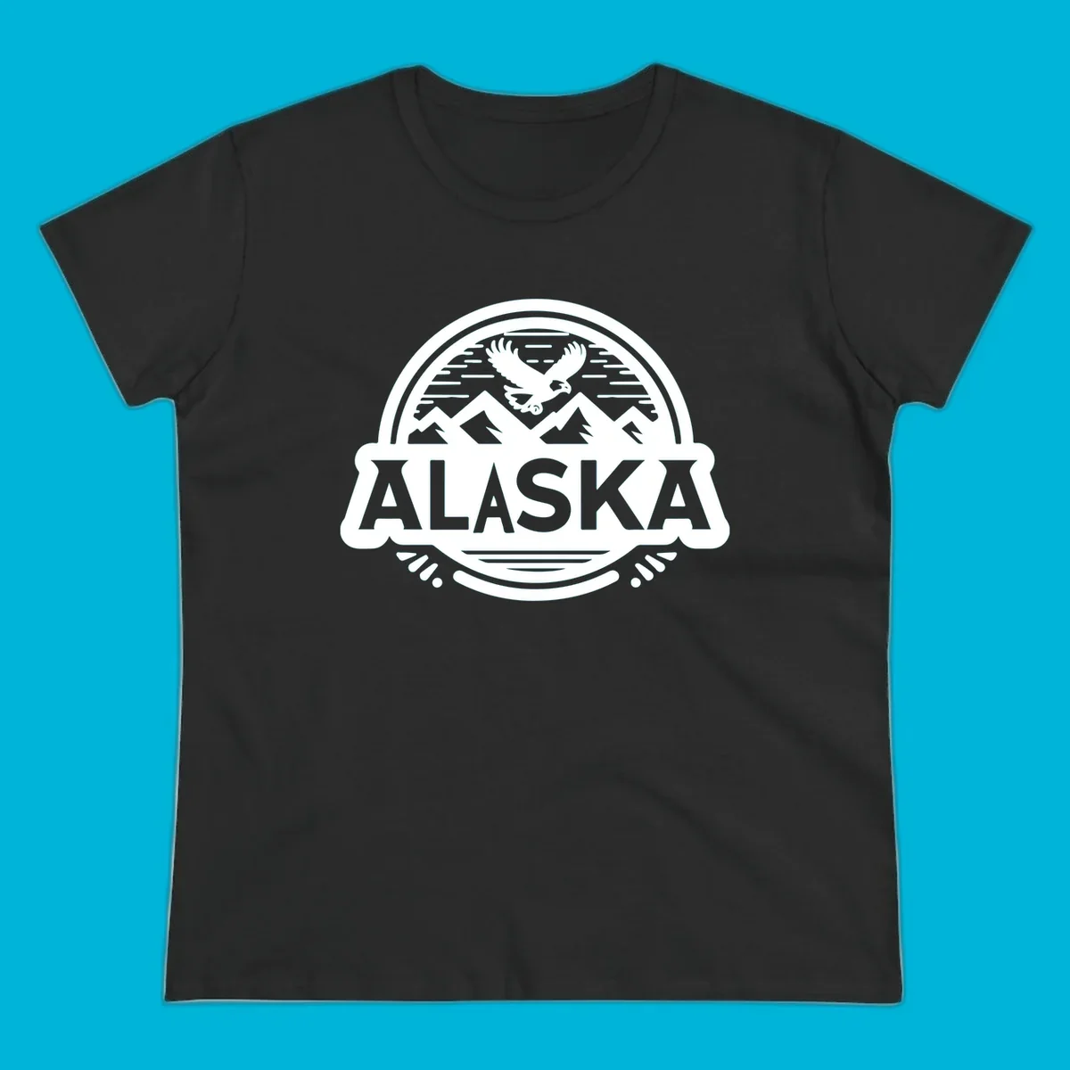 An oval badge design with a bald eagle flying above mountains and water, and the word ALASKA in bold text; alaska-eagle-mountain-badge.