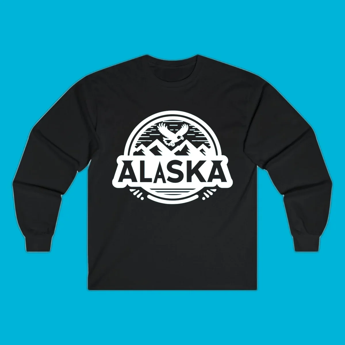 An oval badge design with a bald eagle flying above mountains and water, and the word ALASKA in bold text; alaska-eagle-mountain-badge.