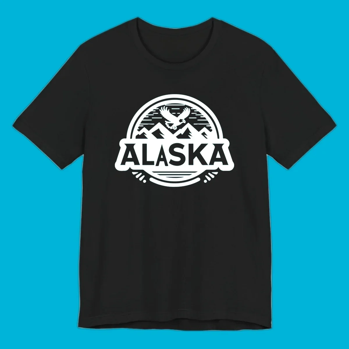 An oval badge design with a bald eagle flying above mountains and water, and the word ALASKA in bold text; alaska-eagle-mountain-badge.