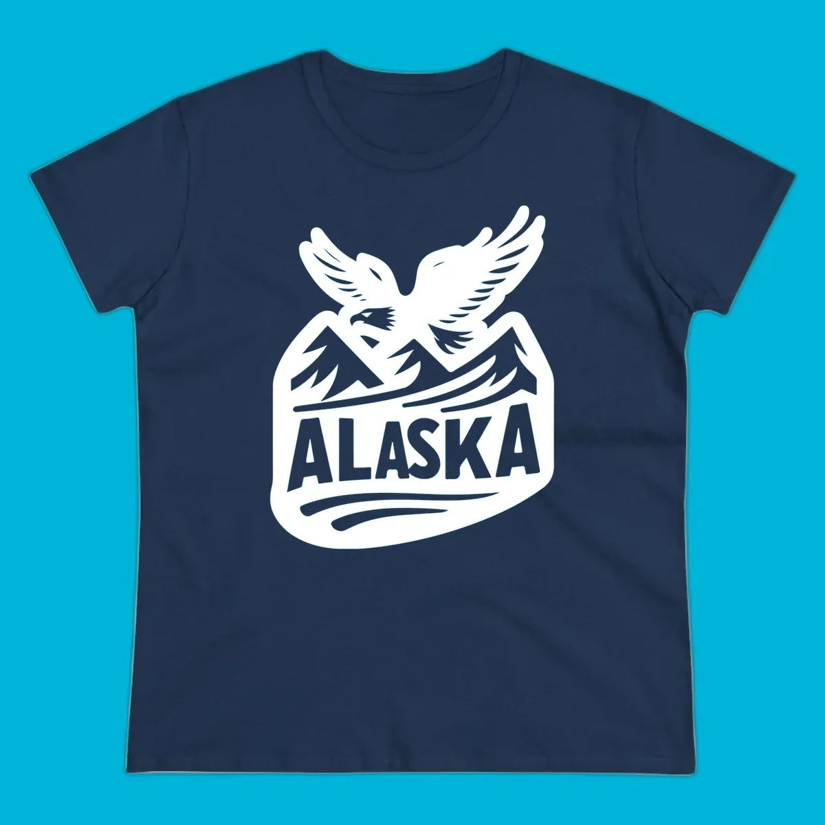 A white and dark blue badge design showing a flying eagle over mountain peaks with "ALASKA" text, for a cruise souvenir.