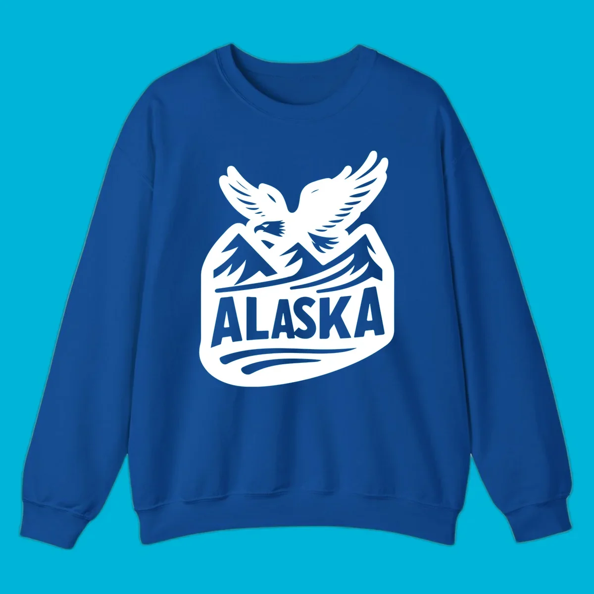 A white and dark blue badge design showing a flying eagle over mountain peaks with "ALASKA" text, for a cruise souvenir.