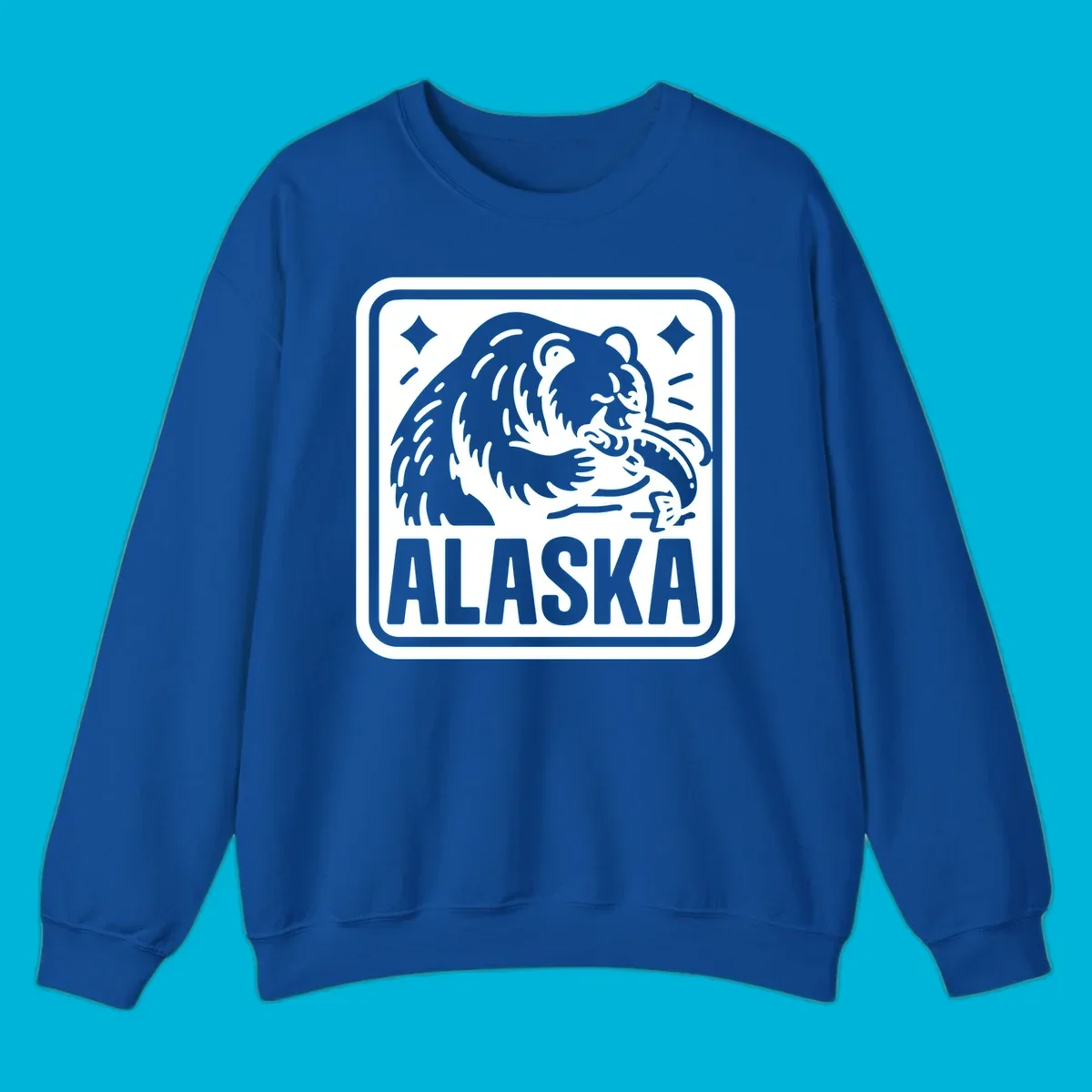 A white alaskan grizzly salmon fishing illustration within a rectangular badge, with 'ALASKA' text.