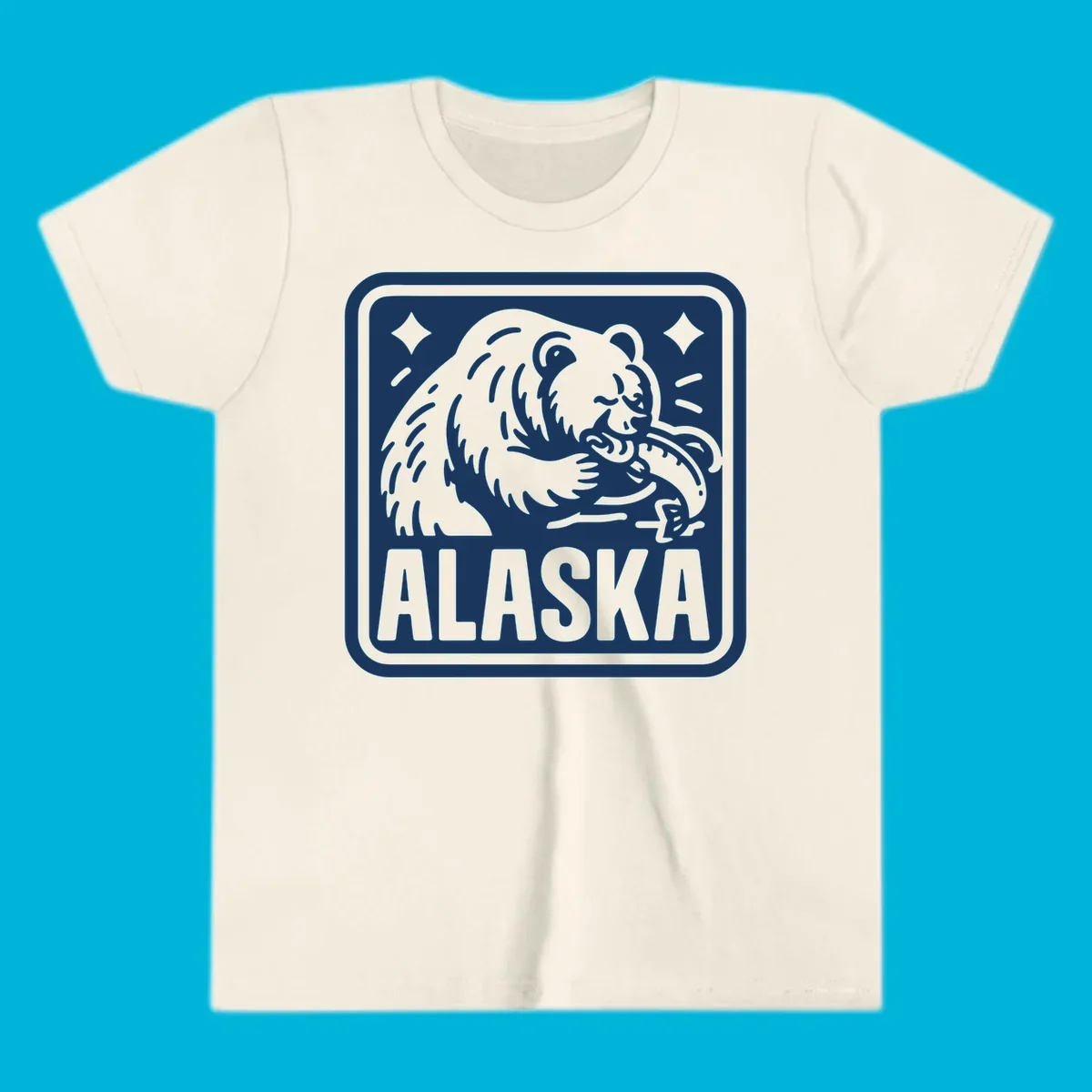 A white alaskan grizzly salmon fishing illustration within a rectangular badge, with 'ALASKA' text.